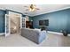 This large bonus room offers space for relaxation, with it's open staircase and modern lighting at 3905 Grandbridge Dr, Apex, NC 27539