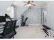 Large exercise room with ample space, offering great natural light and neutral color palette at 3905 Grandbridge Dr, Apex, NC 27539