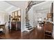 Spacious foyer with hardwood floors, staircase, and elegant furnishings at 3905 Grandbridge Dr, Apex, NC 27539