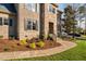 Charming brick and stone home with a well-manicured lawn and inviting walkway at 3905 Grandbridge Dr, Apex, NC 27539