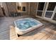 Relaxing hot tub on a wooden deck, offering a serene space for unwinding outdoors at 3905 Grandbridge Dr, Apex, NC 27539