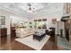 Cozy living room with hardwood floors, coffered ceiling, and stone fireplace at 3905 Grandbridge Dr, Apex, NC 27539