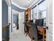 A home office space boasts a built-in desk, natural light, and elegant trim at 3905 Grandbridge Dr, Apex, NC 27539