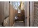 Private outdoor shower with wood and brick accents, perfect for rinsing off after a swim at 3905 Grandbridge Dr, Apex, NC 27539