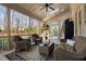 Enjoy the comfort of this screened porch, complete with wicker furniture, ceiling fan and nature views at 3905 Grandbridge Dr, Apex, NC 27539