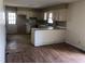 A kitchen featuring vintage cabinetry and fixtures with a view into an adjacent room at 4032 Chaucer Dr, Durham, NC 27705