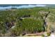 Aerial view of wooded property with views of Lake Tillery at 422 Lower Thrift Rd, New Hill, NC 27562