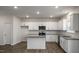 Stylish kitchen featuring white cabinets, granite countertops, and stainless steel appliances at 44 Black Creek Dr, Lillington, NC 27546