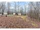 Expansive backyard view featuring a trampoline and mature trees at 441 Wintergreen Rd, Timberlake, NC 27583