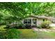 Charming single-story home featuring a well-manicured lawn and tasteful landscaping at 441 Wintergreen Rd, Timberlake, NC 27583