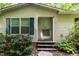 Close-up of the front entrance with decorative shutters and stone pathway at 441 Wintergreen Rd, Timberlake, NC 27583