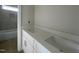 Bathroom showcasing dual vanities and modern fixtures at 4889 Grosbeak Ct, Mebane, NC 27302