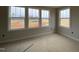 Bright bedroom with large windows offering views of the expansive yard at 4889 Grosbeak Ct, Mebane, NC 27302