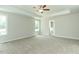 Spacious bedroom features a ceiling fan and plenty of natural light from two large windows at 4889 Grosbeak Ct, Mebane, NC 27302