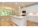 New kitchen featuring white cabinets, stainless steel appliances, and large kitchen island at 4889 Grosbeak Ct, Mebane, NC 27302
