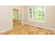 Spacious living area with hardwood floors and natural light at 4889 Grosbeak Ct, Mebane, NC 27302