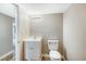 Well-lit bathroom showcasing a modern vanity and toilet against a neutral backdrop at 501 N 14Th St, Erwin, NC 28339