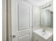 Bright bathroom with a white vanity, modern fixtures, decorative mirror, and a crisp, clean aesthetic at 501 N 14Th St, Erwin, NC 28339