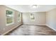 Comfortable bedroom with new wood floor and multiple windows at 501 N 14Th St, Erwin, NC 28339
