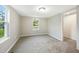 Spacious bedroom with soft carpet, a bright window, and neutral walls, perfect for relaxation and comfort at 501 N 14Th St, Erwin, NC 28339