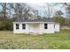 Charming single-story home with light siding and a covered front porch at 501 N 14Th St, Erwin, NC 28339