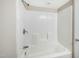 Clean, white tiled shower/tub combination with modern fixtures, offering a pristine and functional bathing space at 501 N 14Th St, Erwin, NC 28339