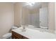 Bathroom includes a large mirror, a white sink and vanity, and a toilet at 5029 Stonewood Pines Dr, Knightdale, NC 27545