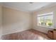 A standard sized bedroom with base molding, a window, and wood floors at 5029 Stonewood Pines Dr, Knightdale, NC 27545