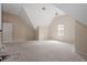Bonus room featuring spacious area, slanted ceilings, neutral paint, and double windows at 5029 Stonewood Pines Dr, Knightdale, NC 27545