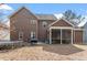Exterior of home showing the back, a trampoline and a screened in porch at 5029 Stonewood Pines Dr, Knightdale, NC 27545