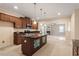 A kitchen with stainless steel appliances, granite countertops, and a central island at 5029 Stonewood Pines Dr, Knightdale, NC 27545