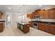 This kitchen features stainless steel appliances, granite countertops, and a center island at 5029 Stonewood Pines Dr, Knightdale, NC 27545