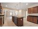 Beautiful kitchen with stainless appliances and center island that has granite countertops at 5029 Stonewood Pines Dr, Knightdale, NC 27545