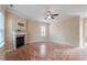 Spacious living room with fireplace and ceiling fan; perfect for relaxation and entertaining at 5029 Stonewood Pines Dr, Knightdale, NC 27545