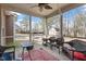 Screened porch with wicker furniture, a ceiling fan, and an outdoor view at 5029 Stonewood Pines Dr, Knightdale, NC 27545