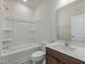 Clean bathroom with a shower-tub combination and a wood-look vanity at 568 Winding Creek Dr, Lillington, NC 27546