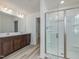 Bathroom featuring a double vanity sink and large glass enclosed shower at 568 Winding Creek Dr, Lillington, NC 27546