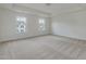 Bright bedroom featuring natural lighting and neutral-toned carpet flooring at 568 Winding Creek Dr, Lillington, NC 27546