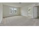 A spacious bedroom featuring natural lighting and plush neutral-toned carpeting at 568 Winding Creek Dr, Lillington, NC 27546
