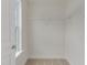 Bright walk-in closet with neutral carpet and shelving at 568 Winding Creek Dr, Lillington, NC 27546
