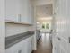 Bright kitchen featuring white cabinets, granite countertops, and stainless steel appliances at 580 Winding Creek Dr, Lillington, NC 27546
