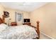 Bedroom featuring a wooden bed frame, a window, and a TV at 5804 Nottoway Ct # A, Raleigh, NC 27609