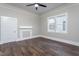 Bright bedroom features hardwood floors, ceiling fan and windows for natural light at 704 Pender St, Rocky Mount, NC 27801