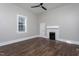 Bedroom features hardwood floors, a ceiling fan and large windows for natural light at 704 Pender St, Rocky Mount, NC 27801