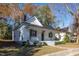 Charming two-story house with white siding, black roof, and front porch at 704 Pender St, Rocky Mount, NC 27801