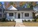 Inviting home with classic architecture, showcasing a quaint porch and manicured front yard at 704 Pender St, Rocky Mount, NC 27801