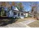 Charming two-story home featuring a welcoming front porch and well-manicured landscaping at 704 Pender St, Rocky Mount, NC 27801