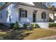 Charming front porch of a white house featuring black iron railings at 704 Pender St, Rocky Mount, NC 27801