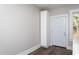 Hallway with modern hardwood floors and white trim at 704 Pender St, Rocky Mount, NC 27801