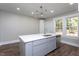 Modern kitchen with a large island, stainless steel appliances, and recessed lighting at 704 Pender St, Rocky Mount, NC 27801